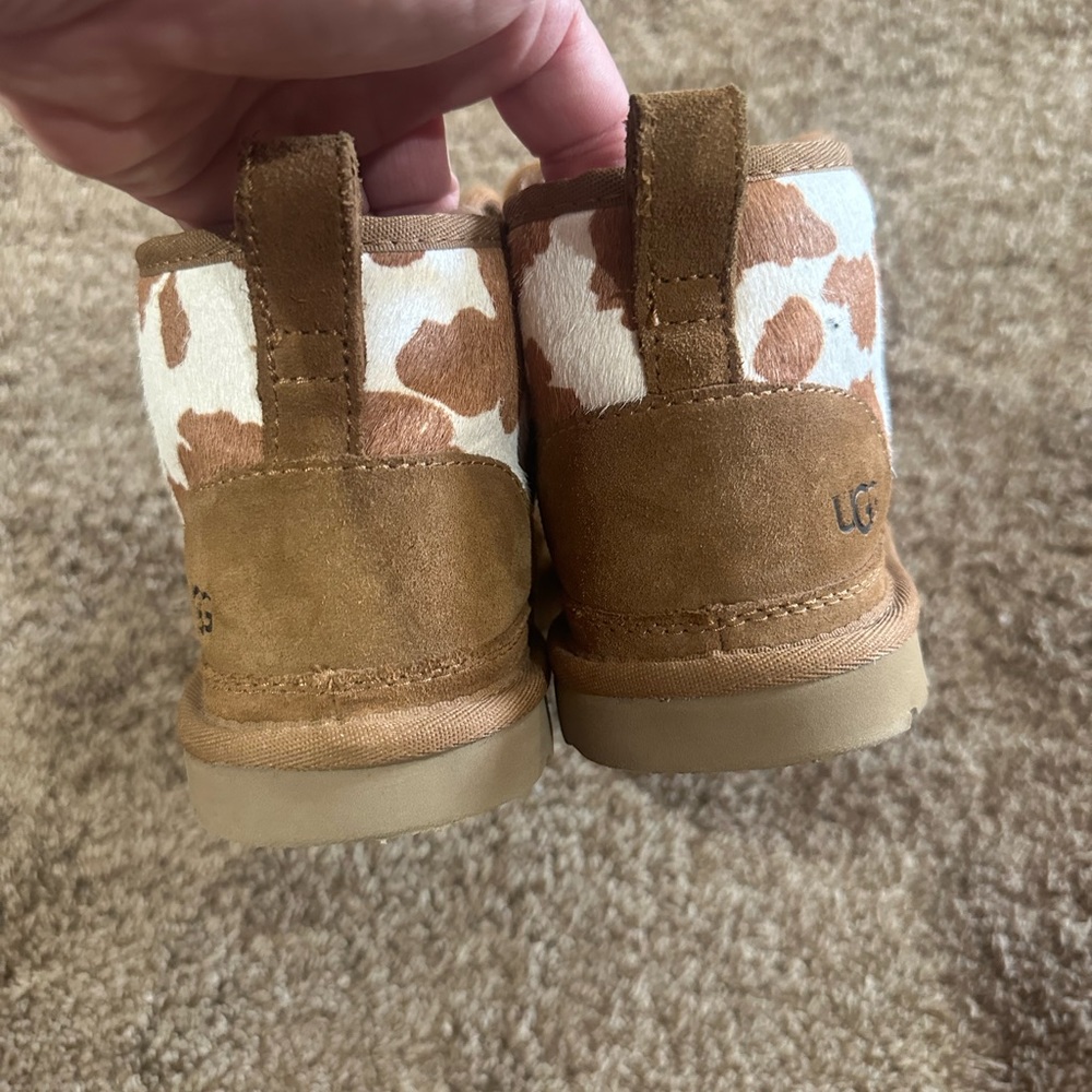 UGG cow print bootie. WOMEN SIZE 5 runs bigger to a 6